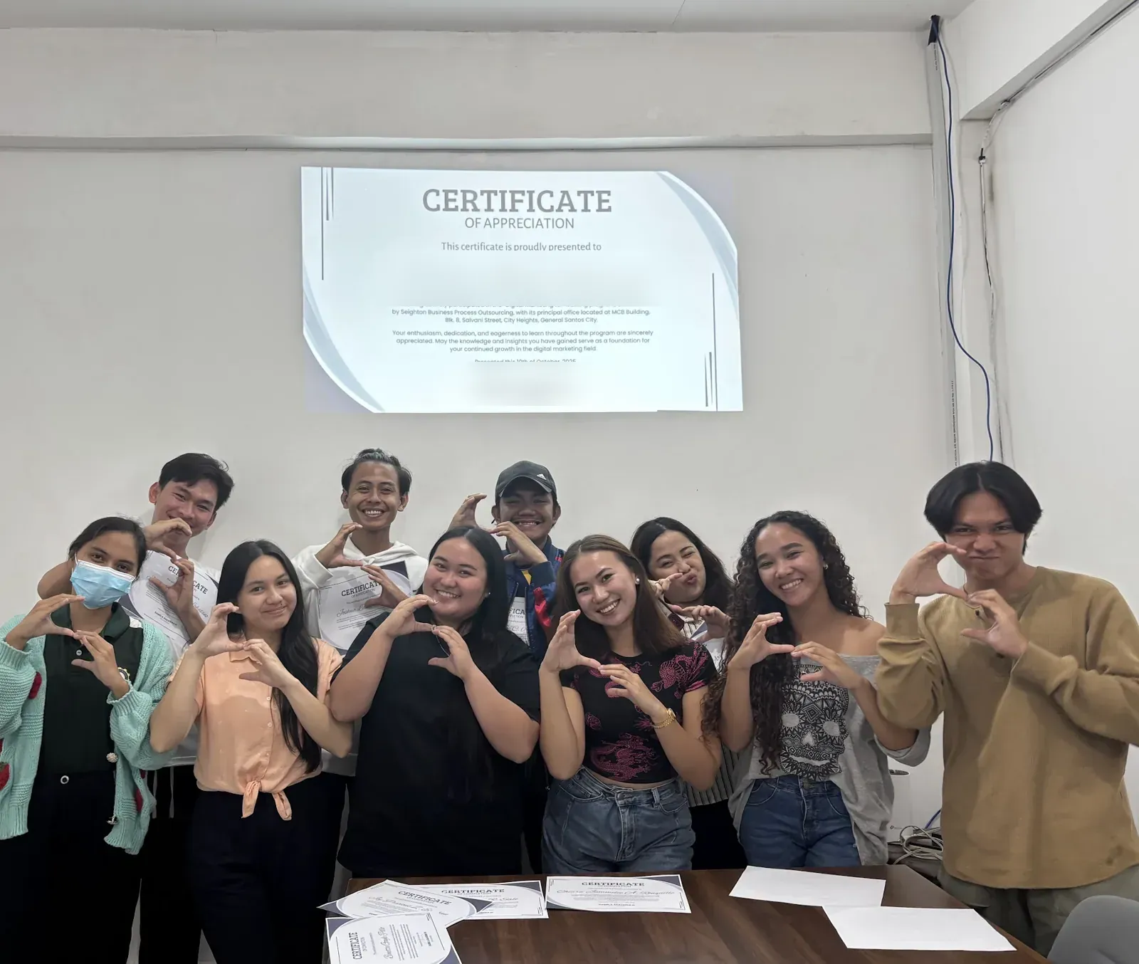 A training batch with their certificates of completion
