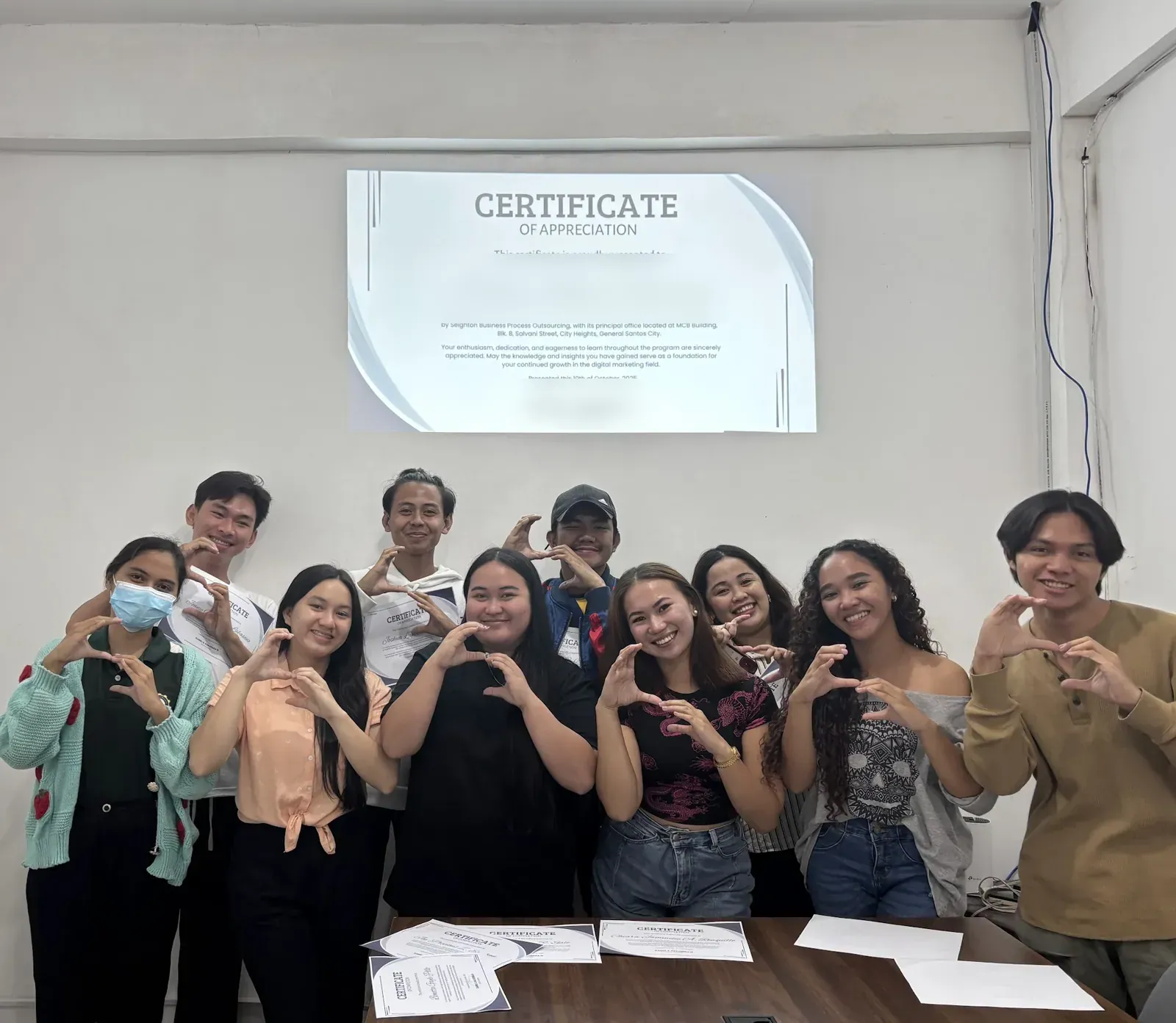 A training batch celebrating at the recognition program